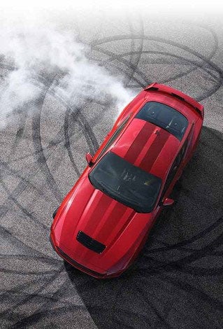 Overhead view of a 2024 Ford Mustang® model with tire tracks on pavement | Coughlin Ford of Heath in Newark OH