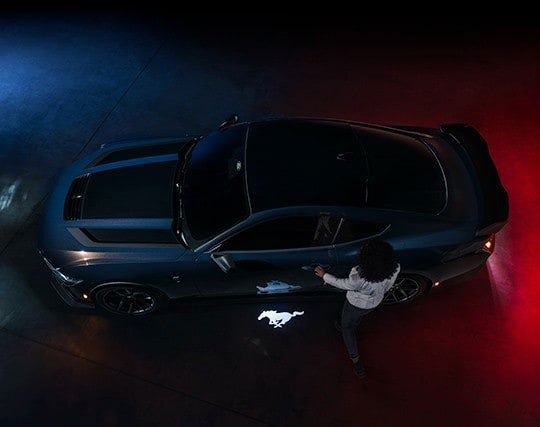 2024 Ford Mustang® Dark Horse™ model with a driver approaching the vehicle | Coughlin Ford of Heath in Newark OH