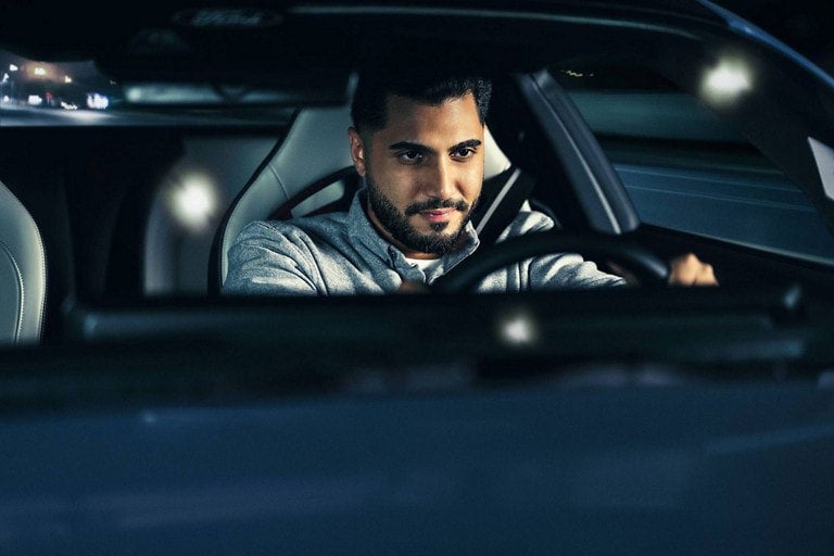 Person sitting in the driver’s seat of a parked 2024 Ford Mustang® coupe | Coughlin Ford of Heath in Newark OH