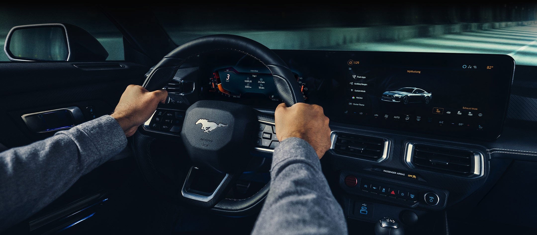 A 2024 Ford Mustang® model interior with a person driving | Coughlin Ford of Heath in Newark OH
